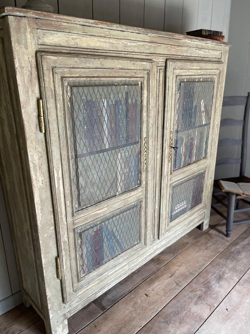 Late 19th century patinated wooden bookcase with trompe l’oeil