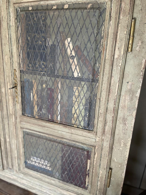 Late 19th century patinated wooden bookcase with trompe l’oeil