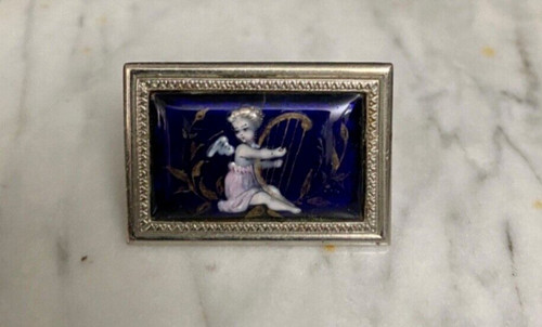 Enamel brooch with cherub design, late 19th century