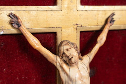 17th century hand-carved crucifix with gilded wooden frame decorated with flowers