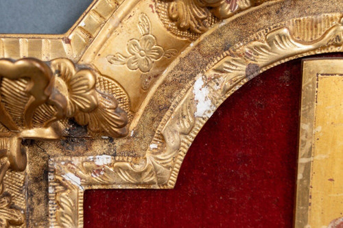 17th century hand-carved crucifix with gilded wooden frame decorated with flowers