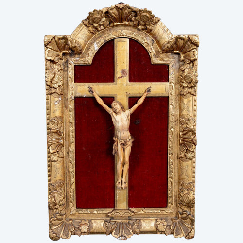 17th century hand-carved crucifix with gilded wooden frame decorated with flowers