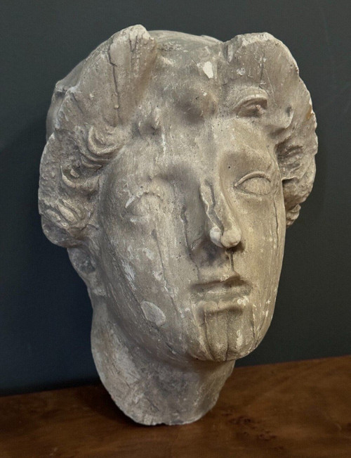 Antique plaster sculpture of a female face from the early 20th century