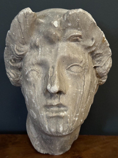 Antique plaster sculpture of a female face from the early 20th century