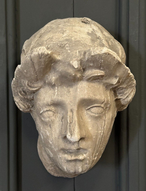 Antique plaster sculpture of a female face from the early 20th century