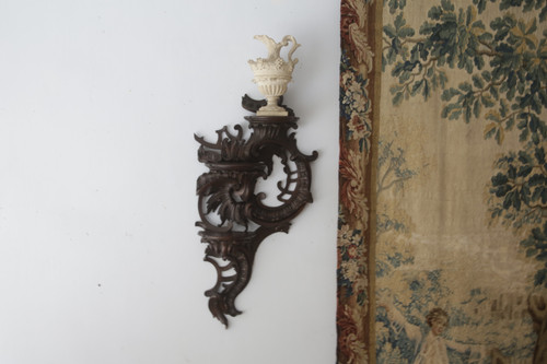  Carved oak wall lamp in the Louis XV rocaille style.