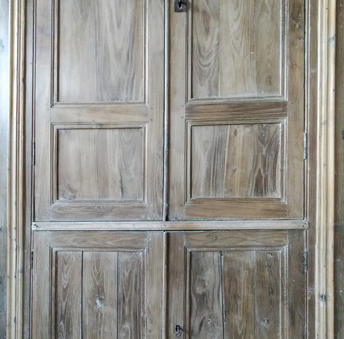 Two antique double cupboard doors in noble wood with their front woodwork frame