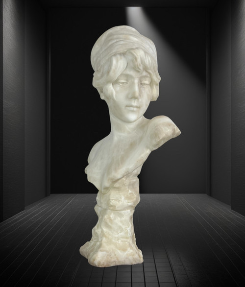 LARGE BUST OF A YOUNG GIRL SIGNED AND NUMBERED "GEORGES MORIN" IN ALABASTER