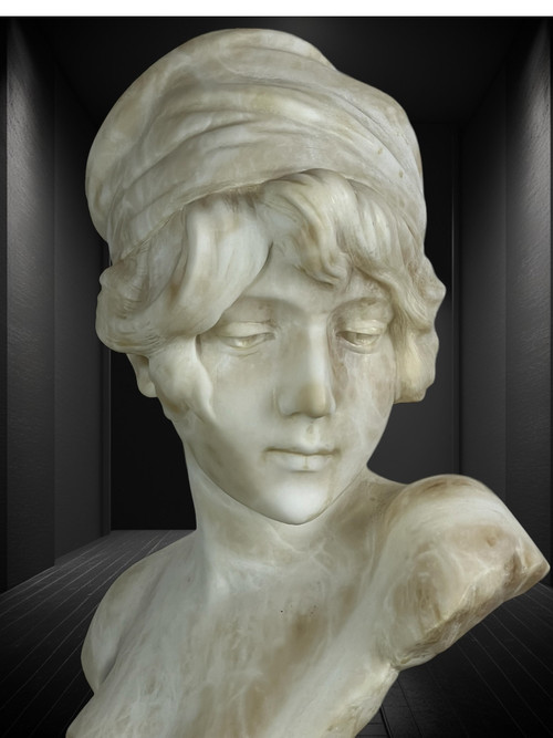 LARGE BUST OF A YOUNG GIRL SIGNED AND NUMBERED "GEORGES MORIN" IN ALABASTER