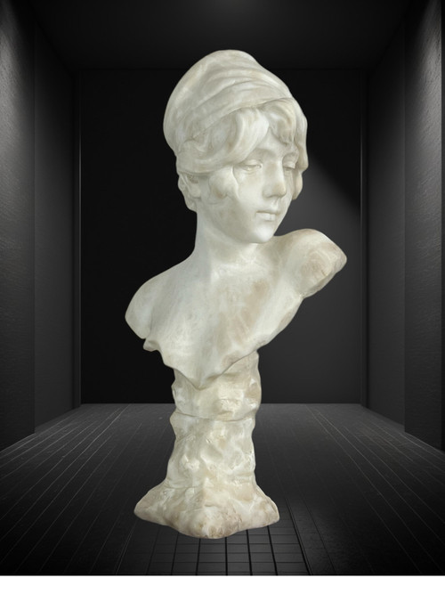 LARGE BUST OF A YOUNG GIRL SIGNED AND NUMBERED "GEORGES MORIN" IN ALABASTER