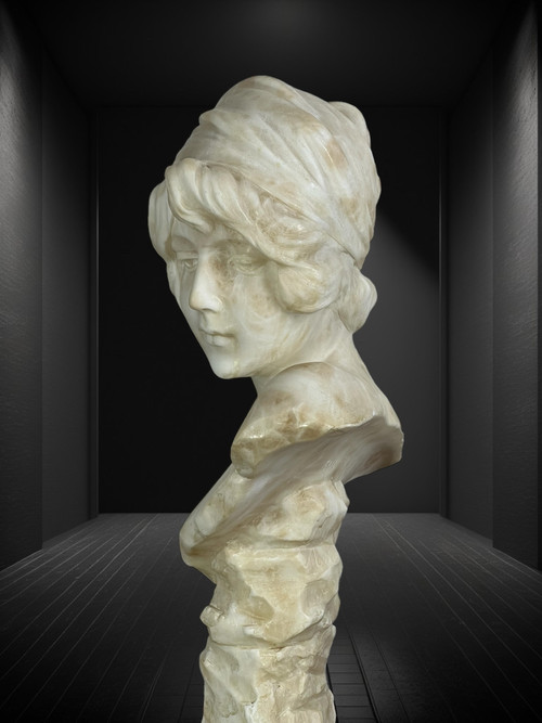 LARGE BUST OF A YOUNG GIRL SIGNED AND NUMBERED "GEORGES MORIN" IN ALABASTER