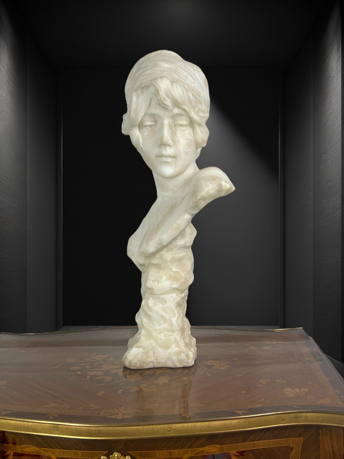 LARGE BUST OF A YOUNG GIRL SIGNED AND NUMBERED "GEORGES MORIN" IN ALABASTER