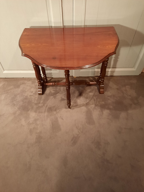 Louis-Philippe period mahogany side table with two folding leaves.