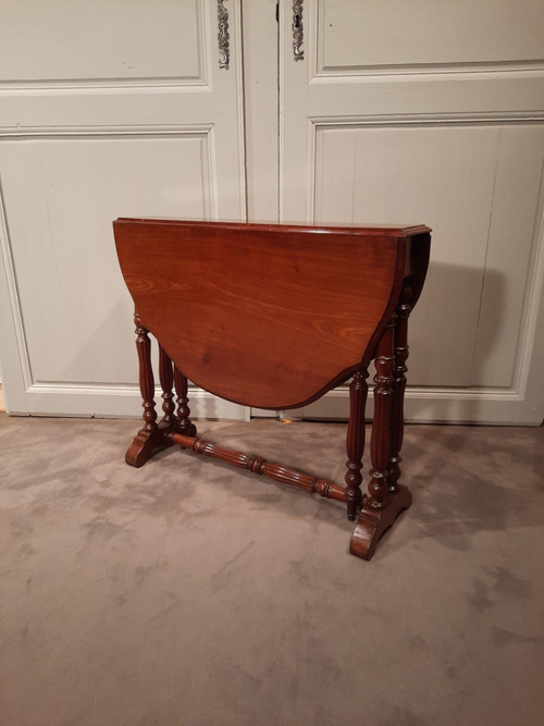 Louis-Philippe period mahogany side table with two folding leaves.