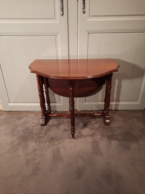 Louis-Philippe period mahogany side table with two folding leaves.