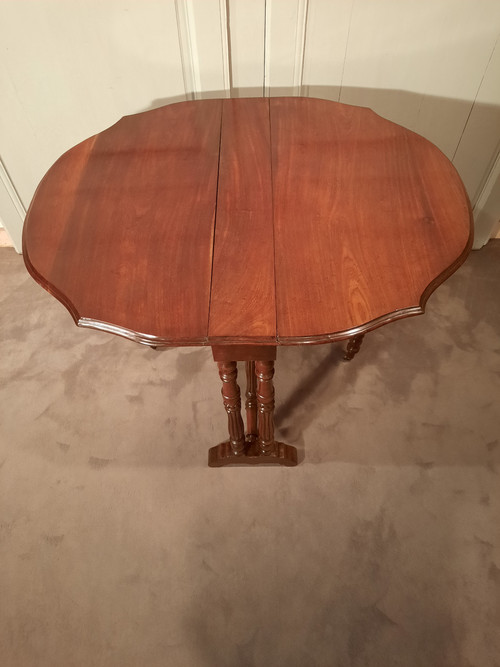 Louis-Philippe period mahogany side table with two folding leaves.