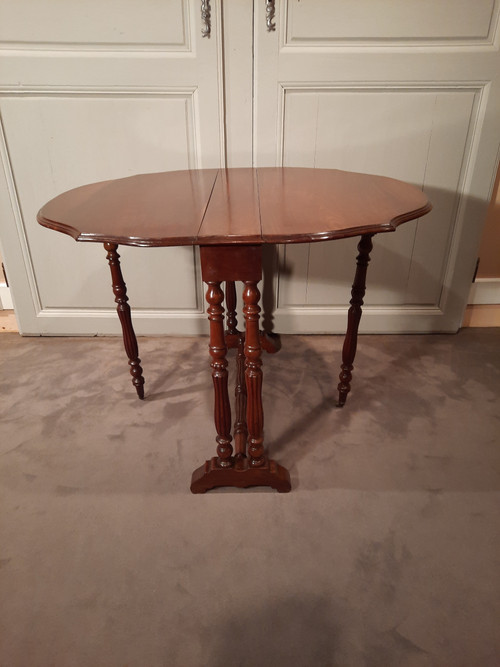 Louis-Philippe period mahogany side table with two folding leaves.