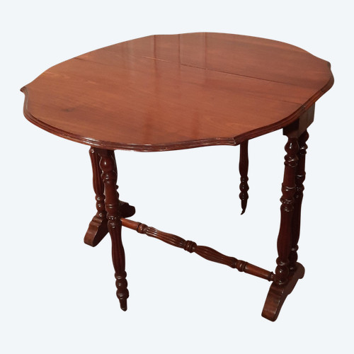 Louis-Philippe period mahogany side table with two folding leaves.