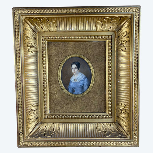 Miniature Painting - Portrait of a Young Woman in a Blue Dress with Cameo, Finely Decorated Gold Frame