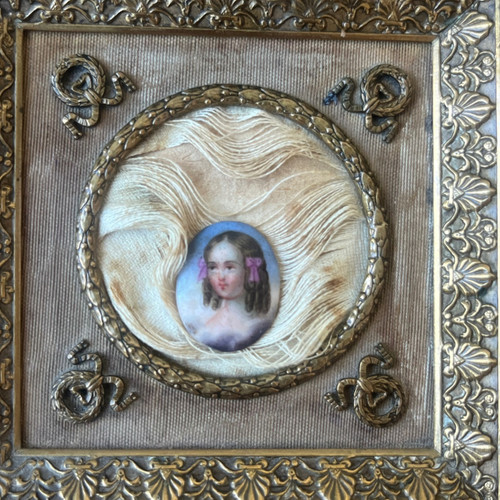 Bronze and brass frame with porcelain medallion