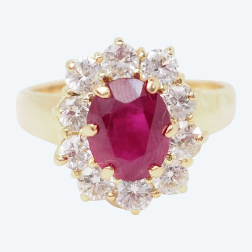 Yellow gold, oval ruby and diamond entourage ring