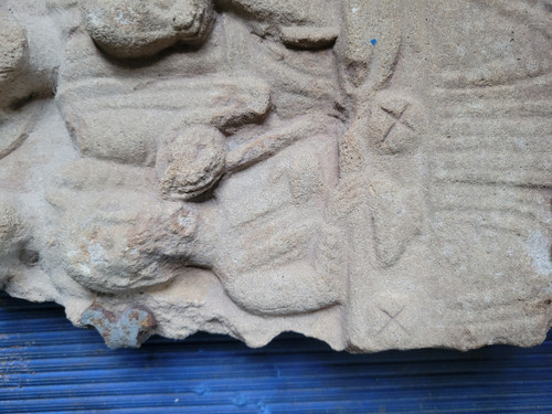 Fragment of high stone relief depicting Christ during the scene.