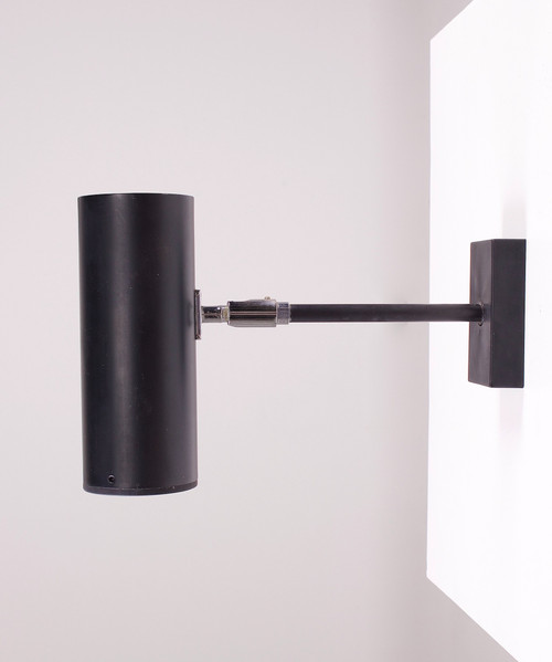 Spot modernist adjustable wall lamp.