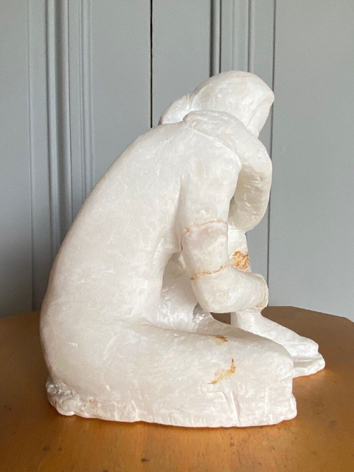 Direct-cut sculpture in onyx stone kneeling woman 20th century