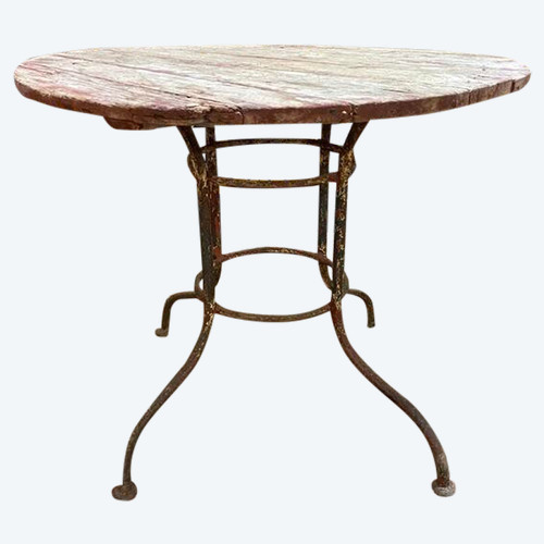 Wrought iron garden table with round top