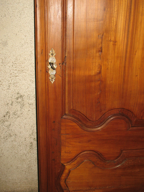 Louis XIV style molded woodwork door in cherry wood, late 18th century