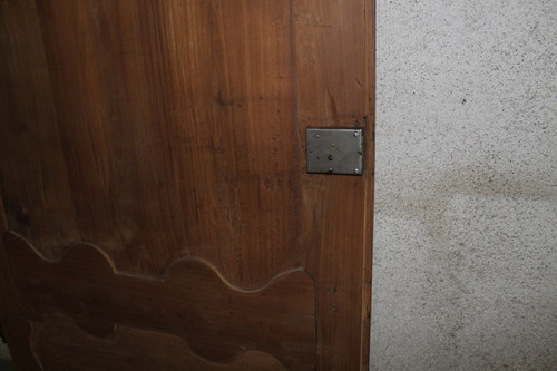 Louis XIV style molded woodwork door in cherry wood, late 18th century