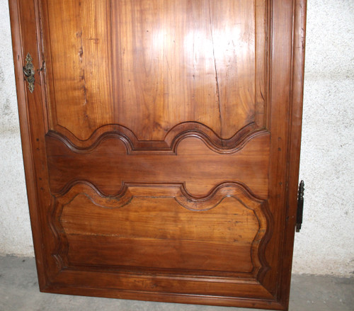 Louis XIV style molded woodwork door in cherry wood, late 18th century