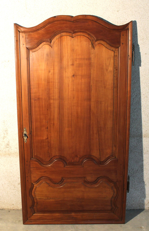 Louis XIV style molded woodwork door in cherry wood, late 18th century