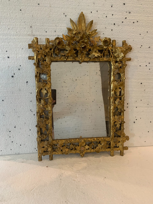 Louis XVI style mirror in carved wood and gilded with gold leaf, 19th century