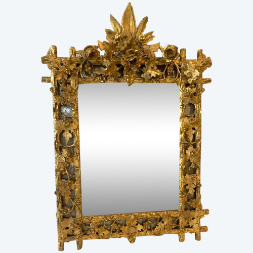 Louis XVI style mirror in carved wood and gilded with gold leaf, 19th century