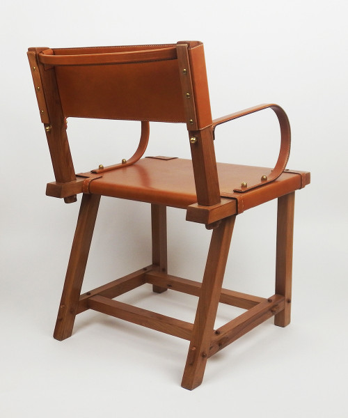 Leather armchair by Jacques Adnet