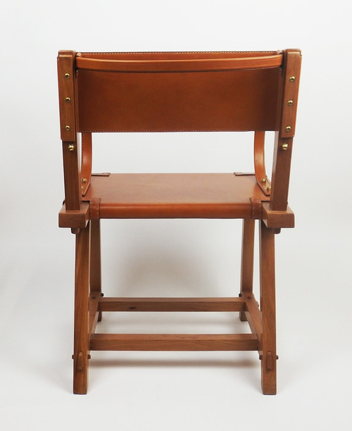 Leather armchair by Jacques Adnet