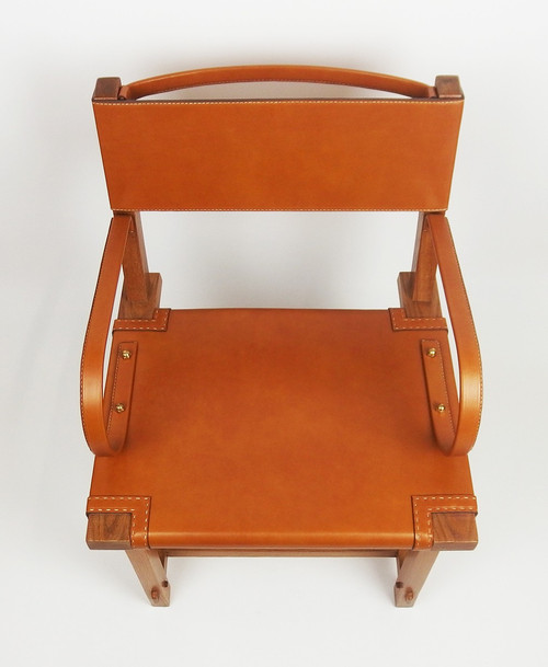 Leather armchair by Jacques Adnet