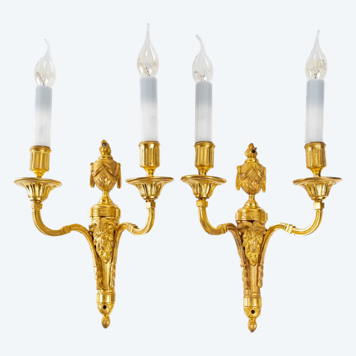 A pair of Louis XVI style ormolu sconces with ram heads, circa 1820.