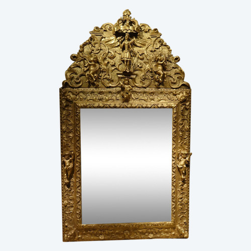 Large gilded wooden pediment mirror, Provence or Italy, 18th century.