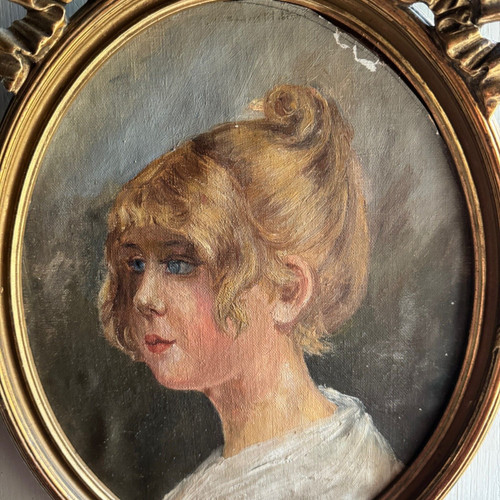 Oil on cardboard portrait of a young girl with blond hair, early 20th century