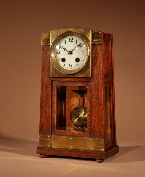 Art Nouveau/Deco Gustav Serrurier-Bovy (1858-1910) A rare oak and brass clock trim,