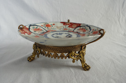 Suite di 4 piatti in bronzo di porcellana giapponese con decorazione Imari