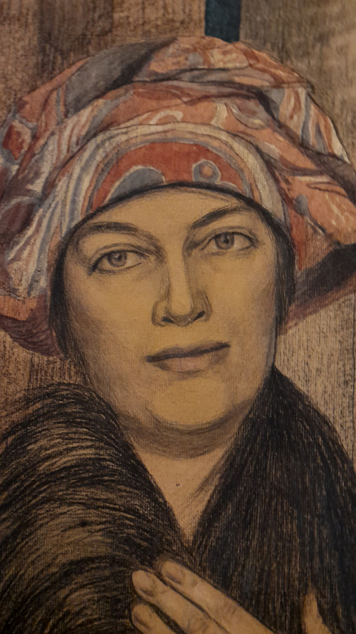 Portrait of a woman drawing with colored pencils