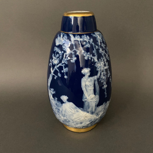 Marcel Chaufriasse Limoges porcelain vase with blue background