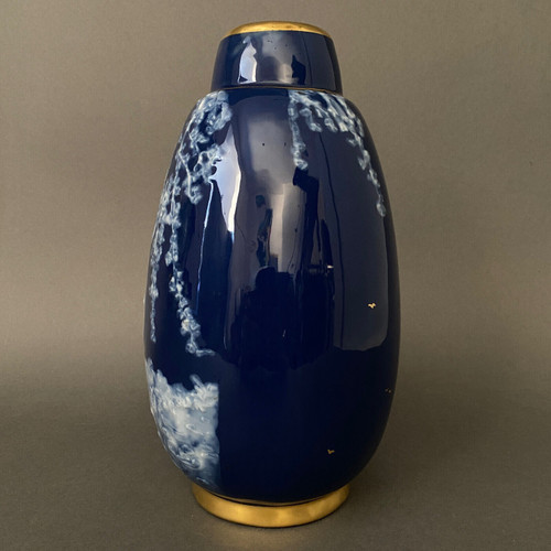 Marcel Chaufriasse Limoges porcelain vase with blue background