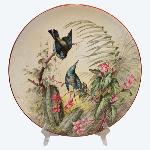 Large earthenware dish decorated with birds and vegetation signed E. Masson, late 19th century