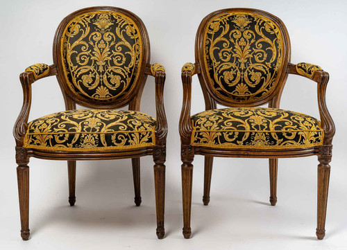 Pair of Louis XVI-style armchairs with medallion backs in carved and waxed molded natural wood