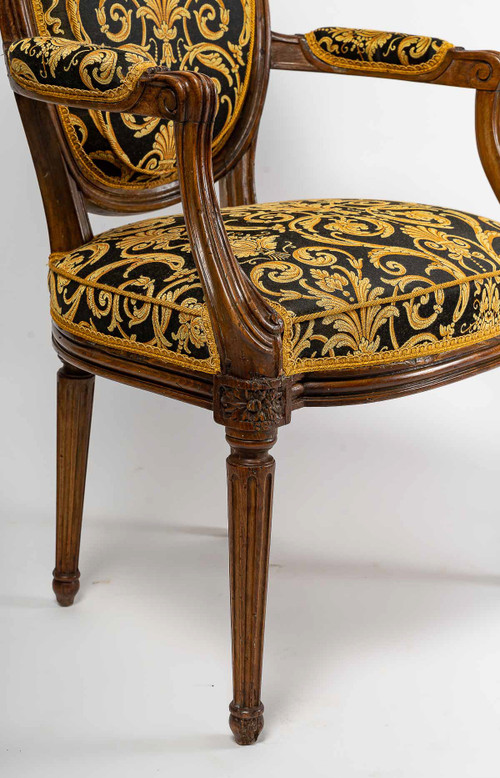 Pair of Louis XVI-style armchairs with medallion backs in carved and waxed molded natural wood