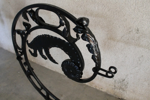 Pair of large wrought iron gallows with Louis XVI style scrollwork, 20th century